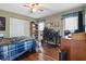 Bedroom features hardwood floors, a ceiling fan, and a closet at 90 Lakeside Dr, Hiram, GA 30141
