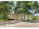 Community clubhouse with beige siding, white trim, covered porch and a parking area in front at 90 Lakeside Dr, Hiram, GA 30141
