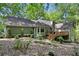 Exterior view of a house featuring a back deck, green siding, and mature landscaping at 90 Lakeside Dr, Hiram, GA 30141