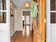 Inviting foyer with gleaming hardwood floors and a decorative wooden front door at 90 Lakeside Dr, Hiram, GA 30141