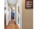 Hallway with hardwood floors leading to laundry and other rooms at 90 Lakeside Dr, Hiram, GA 30141
