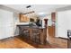 The eat-in kitchen has a breakfast bar with granite countertops and wood cabinets with stainless steel appliances at 90 Lakeside Dr, Hiram, GA 30141