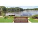 Scenic lake view from a lakeside bench with dock, and lush greenery at 90 Lakeside Dr, Hiram, GA 30141
