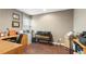 This home office offers natural light from the window, a desk, and hardwood floors at 90 Lakeside Dr, Hiram, GA 30141