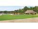 Park pavilion and lake view, with manicured lawn at 90 Lakeside Dr, Hiram, GA 30141