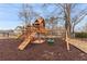 Community playground featuring climbing structure, slide, and swings at 90 Lakeside Dr, Hiram, GA 30141