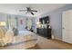 Comfortable bedroom featuring a ceiling fan, an exercise bike, and a sleek, modern dresser at 1101 Collier Nw Rd # U6, Atlanta, GA 30318