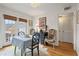 Bright dining room with crystal chandelier, french doors, and hardwood floors at 1101 Collier Nw Rd # U6, Atlanta, GA 30318