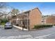 Well-maintained brick apartment building with tidy landscaping and reserved parking at 1101 Collier Nw Rd # U6, Atlanta, GA 30318