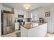 Modern kitchen with stainless steel appliances, granite countertops, and ample cabinet space, perfect for cooking at 1101 Collier Nw Rd # U6, Atlanta, GA 30318