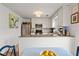 Eat-in kitchen with stainless steel appliances, granite countertops, and white cabinetry at 1101 Collier Nw Rd # U6, Atlanta, GA 30318