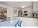 Open kitchen and dining area with modern appliances, granite countertops, and a convenient breakfast bar at 1101 Collier Nw Rd # U6, Atlanta, GA 30318