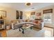 Comfortable living room featuring a large sectional sofa, hardwood floors, and bright natural light at 1101 Collier Nw Rd # U6, Atlanta, GA 30318