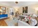 Cozy living room featuring a comfortable sectional sofa, stylish glass coffee table, and bright, colorful decor at 1101 Collier Nw Rd # U6, Atlanta, GA 30318