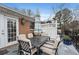 Spacious patio with outdoor dining set, grill, and brick detailing at 1101 Collier Nw Rd # U6, Atlanta, GA 30318
