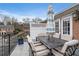 Spacious patio with outdoor dining set, grill, and white lattice fencing at 1101 Collier Nw Rd # U6, Atlanta, GA 30318