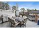 Spacious patio with outdoor dining set, grill, and wrought iron railing at 1101 Collier Nw Rd # U6, Atlanta, GA 30318