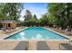 A refreshing community pool surrounded by lounge chairs, perfect for relaxation and enjoying the outdoors at 1101 Collier Nw Rd # U6, Atlanta, GA 30318