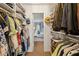 Walk-in closet featuring custom built-in shelving and clothing racks at 1101 Collier Nw Rd # U6, Atlanta, GA 30318
