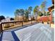 View of the painted back deck with wood railing at 11365 Donnington Dr, Duluth, GA 30097