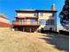 The backyard features a sprawling lawn and a spacious wooden deck at 11365 Donnington Dr, Duluth, GA 30097