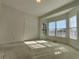 Bedroom featuring a closet door, neutral carpet, and windows at 11365 Donnington Dr, Duluth, GA 30097