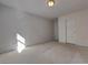 Bedroom featuring neutral carpet, one window, and a closet door at 11365 Donnington Dr, Duluth, GA 30097