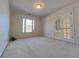 Inviting bedroom with natural light, French doors and plush carpeting to maximize comfort at 11365 Donnington Dr, Duluth, GA 30097
