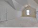 Expansive bonus room with a dormer window and cozy carpeting to maximize functionality at 11365 Donnington Dr, Duluth, GA 30097