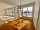 Sun-filled dining area with hardwood floors and natural light streaming through the large windows at 11365 Donnington Dr, Duluth, GA 30097