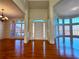 Grand foyer with hardwood floors, a bright entryway, and large windows providing natural light at 11365 Donnington Dr, Duluth, GA 30097