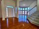 Inviting foyer with hardwood floors, stairs, and a bright entryway with large windows at 11365 Donnington Dr, Duluth, GA 30097