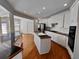 Modern kitchen with stainless steel appliances, hardwood floors and granite countertops at 11365 Donnington Dr, Duluth, GA 30097