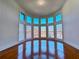Sun-drenched living space with bay windows offering lots of natural light and gleaming hardwood floors at 11365 Donnington Dr, Duluth, GA 30097
