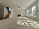 Open living space featuring a fireplace, multiple windows, and a staircase at 11365 Donnington Dr, Duluth, GA 30097