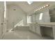 Well-lit main bathroom with a soaking tub, vanity, and separate shower at 11365 Donnington Dr, Duluth, GA 30097