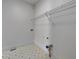 Small storage room with vinyl tile flooring and a wire rack at 11365 Donnington Dr, Duluth, GA 30097