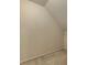 Cozy attic storage area with neutral carpet can be used to easily store belongings at 11365 Donnington Dr, Duluth, GA 30097