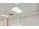 Finished basement with drop ceiling, recessed lights, and white shelving, offering ample storage at 140 Grosvenor Pl, Atlanta, GA 30328