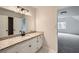 Bathroom with a granite countertop vanity and light fixtures and carpeted room view at 140 Grosvenor Pl, Atlanta, GA 30328