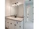 Bathroom featuring vanity with granite counters, modern lighting and a doorway to another room at 140 Grosvenor Pl, Atlanta, GA 30328