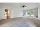 Large carpeted bedroom with French doors to the back patio and white trim at 140 Grosvenor Pl, Atlanta, GA 30328