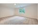 Cozy bedroom with a large window and neutral carpet at 140 Grosvenor Pl, Atlanta, GA 30328