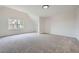 Spacious bedroom featuring plush carpeting, natural light from a large window, and neutral paint at 140 Grosvenor Pl, Atlanta, GA 30328