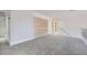 Upstairs bonus room featuring plush carpet, white railing, and neutral paint at 140 Grosvenor Pl, Atlanta, GA 30328