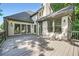 Expansive deck of a home, perfect for entertaining with views of the surrounding trees and blue sky at 140 Grosvenor Pl, Atlanta, GA 30328