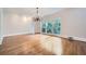 Elegant dining room featuring hardwood floors and a stunning chandelier at 140 Grosvenor Pl, Atlanta, GA 30328