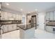 Well-lit kitchen with granite countertops, stainless steel appliances, and mosaic backsplash at 140 Grosvenor Pl, Atlanta, GA 30328