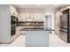 Bright, updated kitchen featuring stainless steel appliances, double ovens, and a central island at 140 Grosvenor Pl, Atlanta, GA 30328