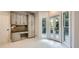 Cozy kitchen with built-in desk area and convenient access to the outdoor deck at 140 Grosvenor Pl, Atlanta, GA 30328